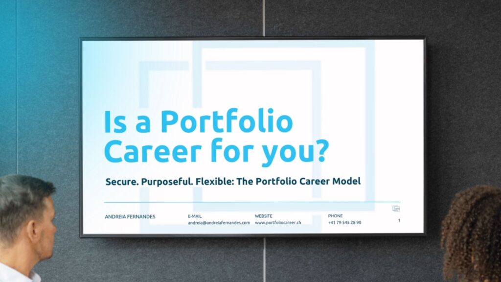 Screen on wall - Andreia Fernandes presenting her Portfolio Career Webinar – Screen shows cover of presentation – Big Letters stating "Is a Portfolio Career for you?"